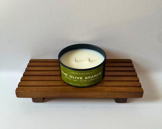 The Olive Branch - 5 oz candle tin opened to display double-wick