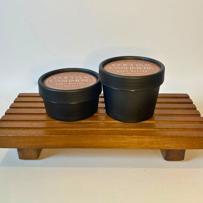 Cocoa & Cashmere body butter in 50g and 100g sizes, shown side by side for size comparison