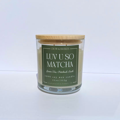 Matcha green tea candle with a wooden lid on a white background