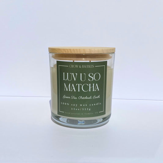 Matcha green tea candle with a wooden lid on a white background