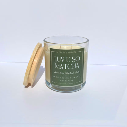 Matcha green tea candle with a wooden lid on a white background