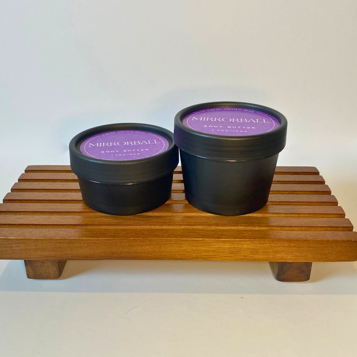 Mirrorball body butter in 50g and 100g sizes, shown side by side for size comparison