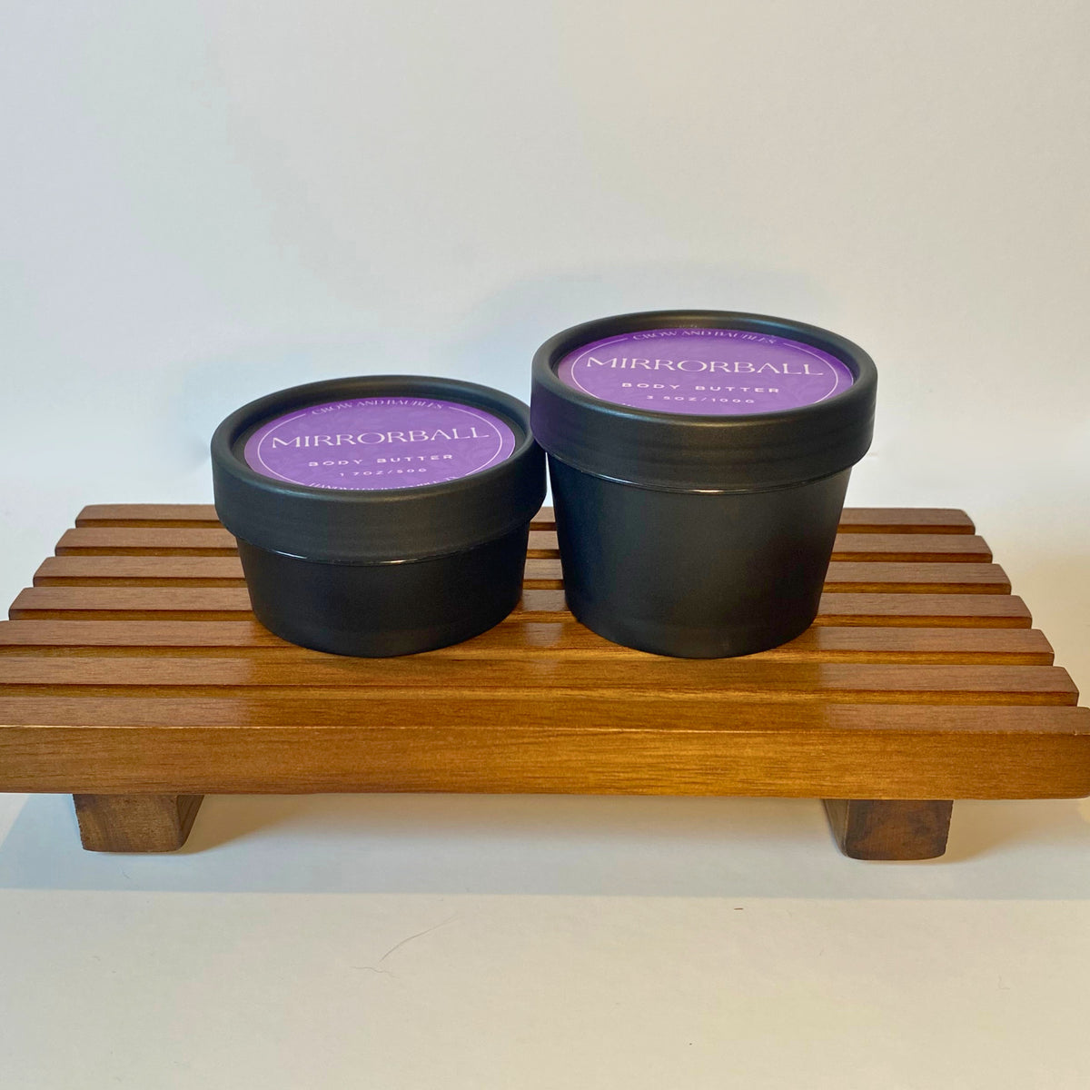 Mirrorball body butter in 50g and 100g sizes, shown side by side for size comparison